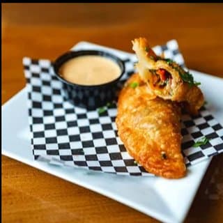 King Sauce served with golden empanadas