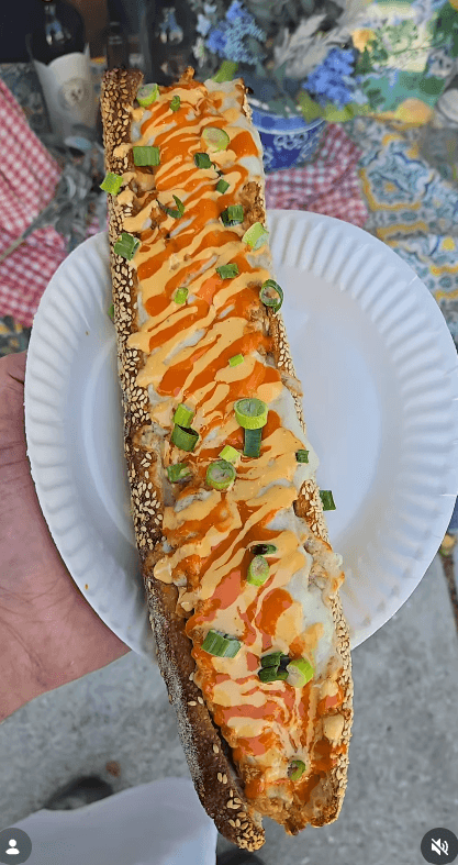Loaded sandwich drizzled with King Sauce